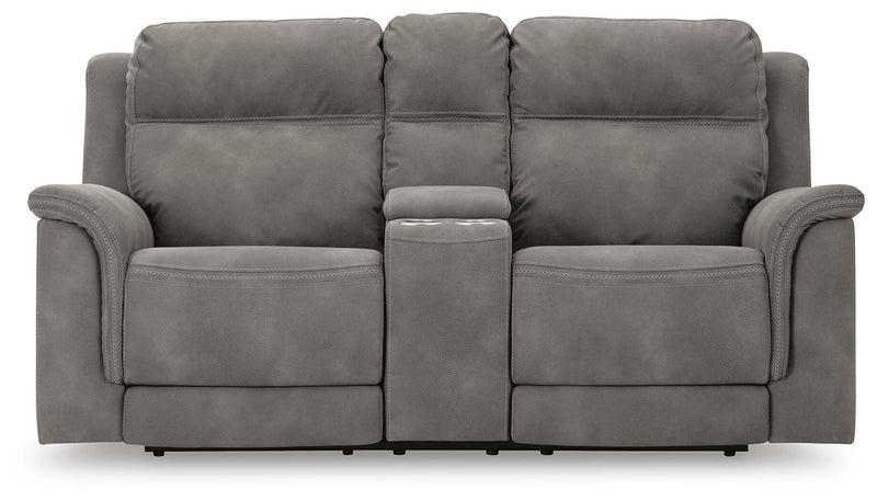 Ashley Furniture Next-Gen DuraPella power reclining loveseat with console, shown head-on in a modern living room setting.