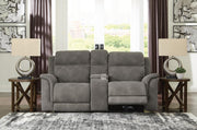 Ashley Furniture Next-Gen DuraPella Power Reclining Loveseat with console, featuring plush cushions and built-in cup holders.