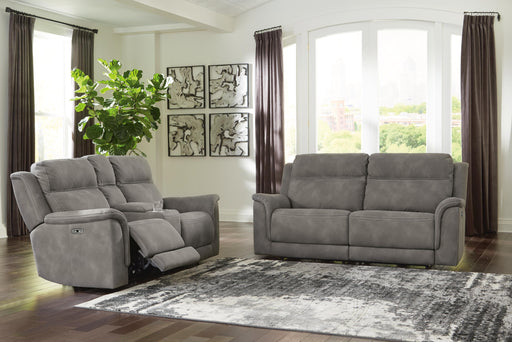 Open-view of Ashley Furniture Next-Gen DuraPella living room set with plush sofa and matching armchair in a modern living space.