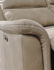 Ashley Furniture Next-Gen DuraPella power reclining loveseat with stitched detailing and built-in console, featuring plush cushioning.