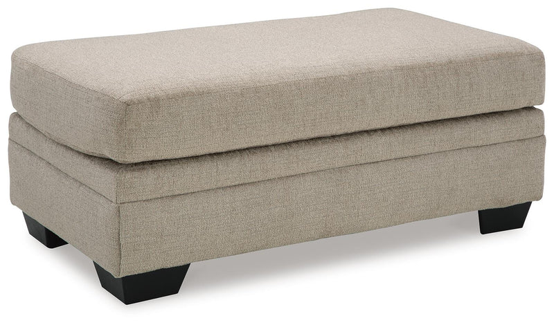 Ashley Furniture Stonemeade living room set featuring a sofa and loveseat with neutral fabric upholstery.