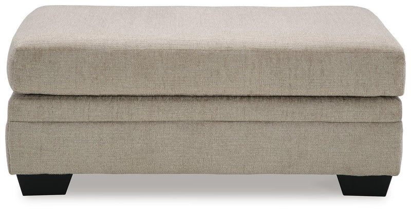 Ashley Furniture Stonemeade living room set with sofa and armchair in neutral upholstery, shown with head-on view.