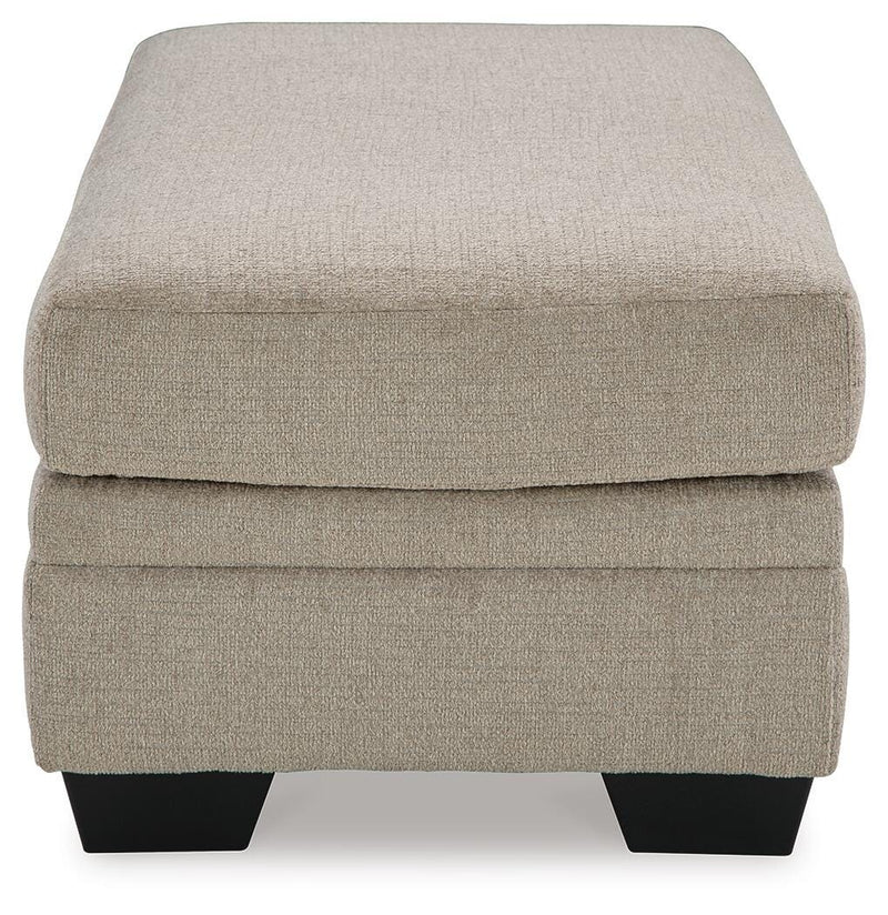 Ashley Furniture Stonemeade living room set with sofa and armchair, featuring neutral upholstery and stylish design.