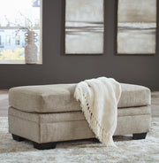 Ashley Furniture Stonemeade living room set with sofa and armchair, featuring neutral upholstery and wooden accents.