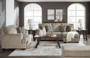 Ashley Furniture Stonemeade living room set with sofa, loveseat, and armchair in neutral fabric, arranged in a cozy seating area.