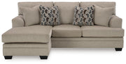 Ashley Furniture Stonemeade living room set with beige fabric sofa and loveseat, featuring plush cushions and wooden legs.