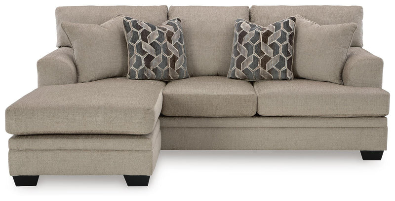 Ashley Furniture Stonemeade living room set with beige fabric sofa and loveseat, featuring plush cushions and wooden legs.