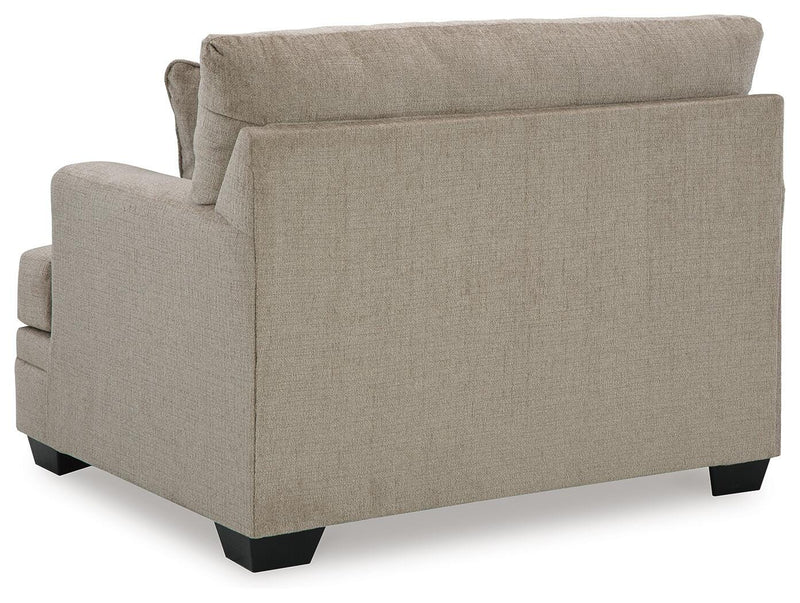 Ashley Furniture Stonemeade living room set with sofa, loveseat, and armchair arranged in a modern living space.