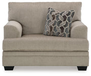 Ashley Furniture Stonemeade living room set featuring a sofa and armchair with plush cushions and neutral fabric upholstery.