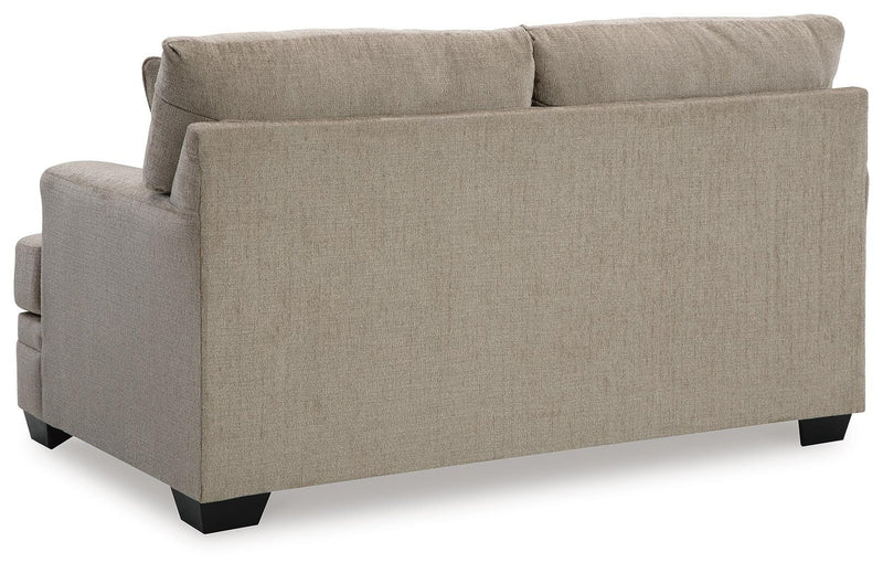 Ashley Furniture Stonemeade living room set with sofa and armchair, showcasing plush cushions and elegant upholstery.