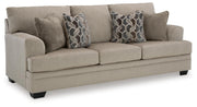 Ashley Furniture Stonemeade living room set with sofa, loveseat, and chairs arranged in a modern living space.