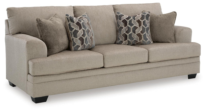 Ashley Furniture Stonemeade living room set with sofa, loveseat, and chairs arranged in a modern living space.