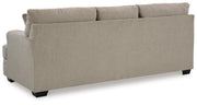 Ashley Furniture Stonemeade living room set with sofa and armchair, featuring plush cushions and neutral fabric upholstery.