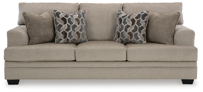 Ashley Furniture Stonemeade living room set featuring a sofa and loveseat with neutral fabric and decorative cushions.