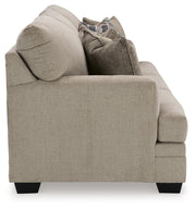 Ashley Furniture Stonemeade living room set with sofa and armchair in a modern design, featuring neutral upholstery and wooden legs.