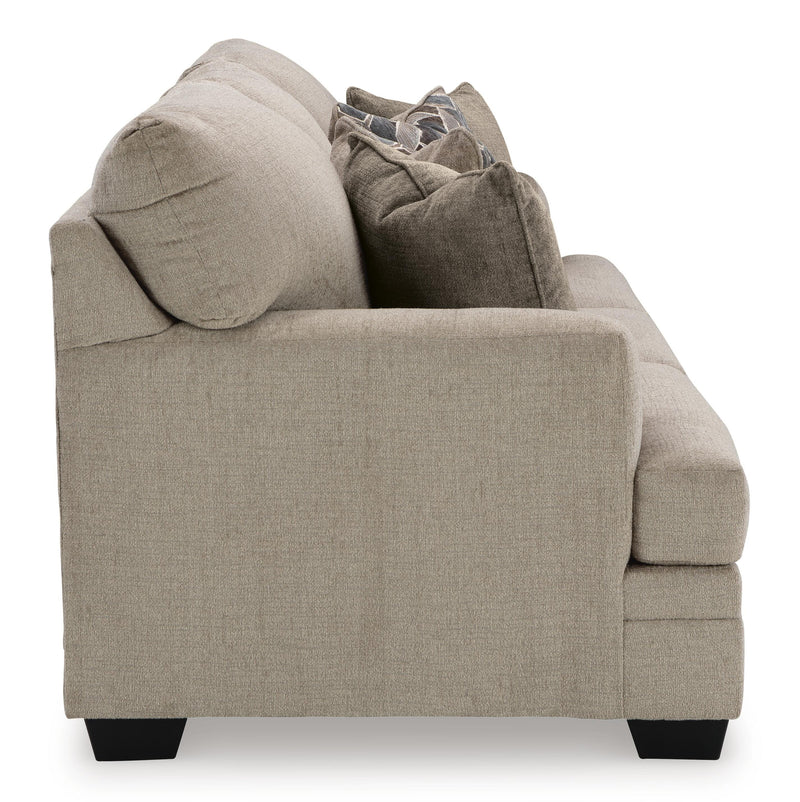 Ashley Furniture Stonemeade living room set featuring a sofa and loveseat with neutral upholstery and wooden accents.