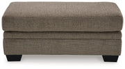 Ashley Furniture Stonemeade living room set with sofa and armchair, featuring neutral fabric upholstery and wooden legs.