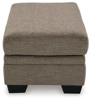 Ashley Furniture Stonemeade living room set with sofa and armchair, featuring neutral upholstery and wooden accents.