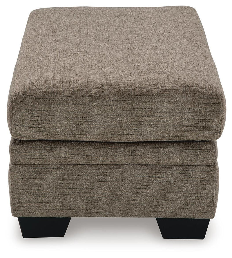 Ashley Furniture Stonemeade living room set with sofa and armchair, featuring neutral upholstery and wooden accents.