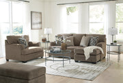 Ashley Furniture Stonemeade living room set with plush sofa, armchair, and coordinating ottomans in a modern fabric design.