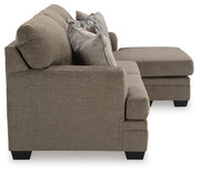 Ashley Furniture Stonemeade living room set with sofa and loveseat in neutral fabric, shown in a stylish modern living space.
