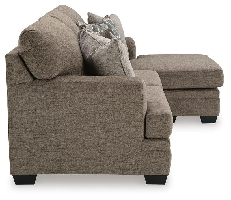 Ashley Furniture Stonemeade sofa chaise with plush upholstery and side view, showcasing its comfortable chofa design.