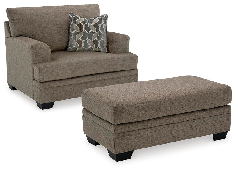Ashley Furniture Stonemeade living room set with sofa and armchair, featuring neutral upholstery and modern design.