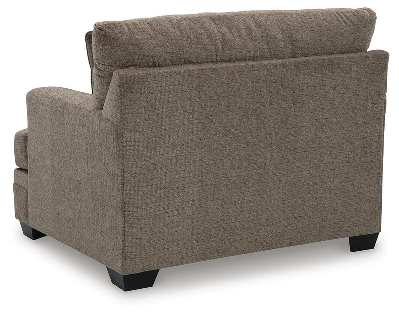 Ashley Furniture Stonemeade living room set with sofa and armchair, featuring neutral upholstery and modern design.