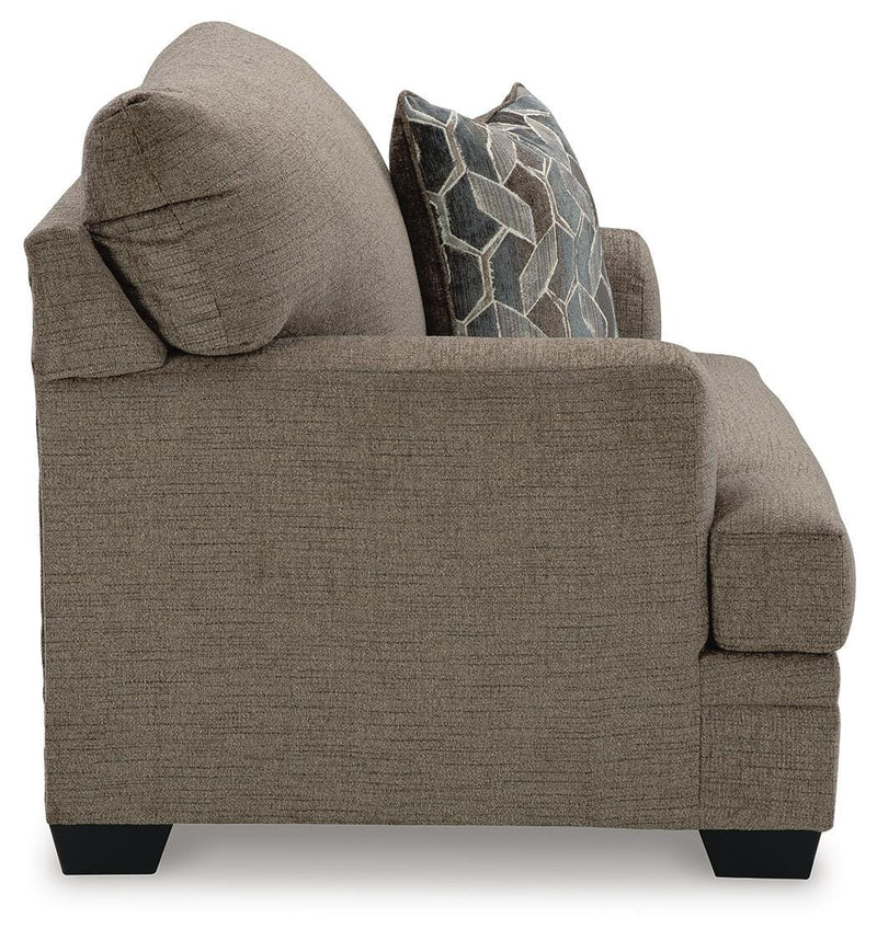 Ashley Furniture Stonemeade living room set with sofa, armchair, and coffee table in a modern design.