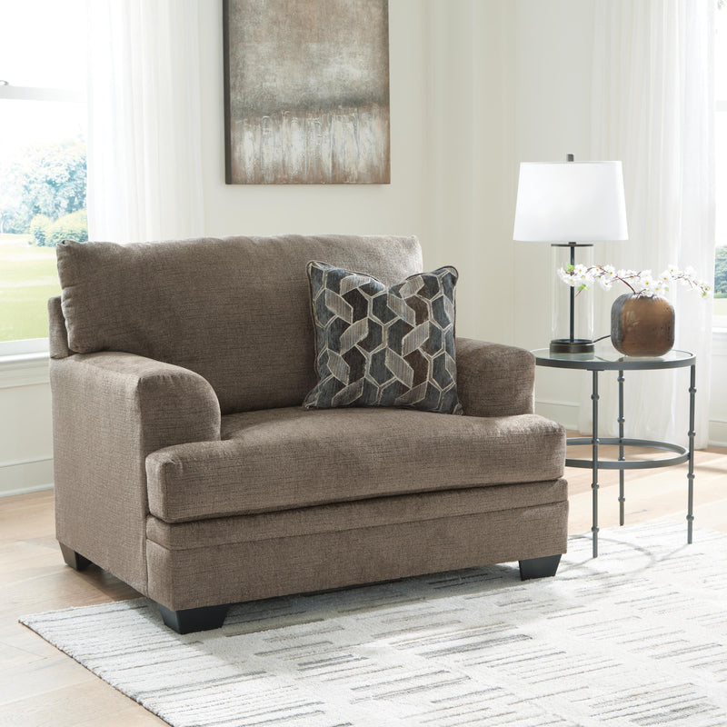 Ashley Furniture Stonemeade living room set with plush sofa and armchairs, featuring neutral fabric and wooden legs.