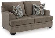 Ashley Furniture Stonemeade living room set with sofa and armchair, featuring plush cushions and neutral fabric upholstery.