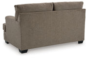 Ashley Furniture Stonemeade living room set with upholstered sofa and armchair, shown from the back in a modern living space.