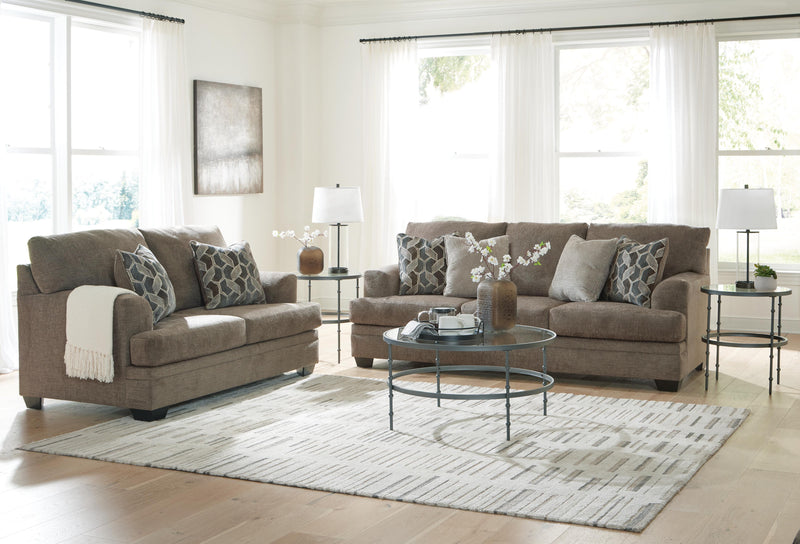 Ashley Furniture Stonemeade living room set with sofa and armchair, featuring neutral fabric upholstery and contemporary design.