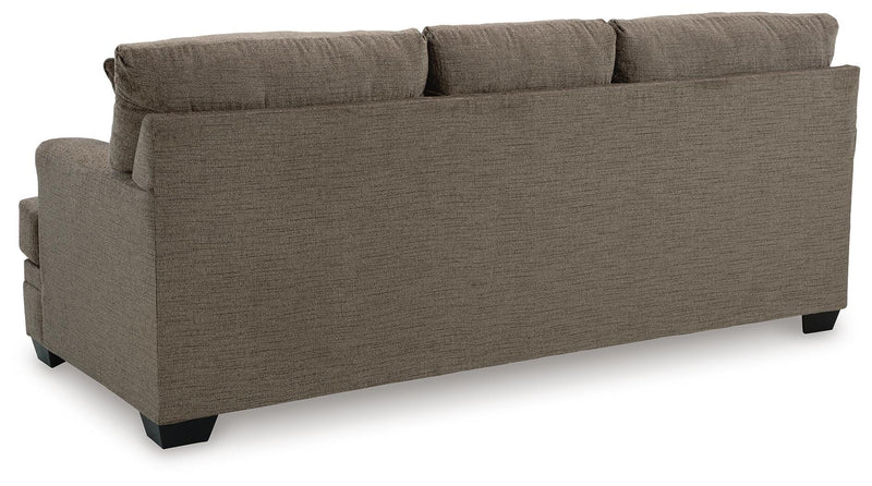 Ashley Furniture Stonemeade living room set with sofa and armchair, featuring neutral upholstery and wooden legs.