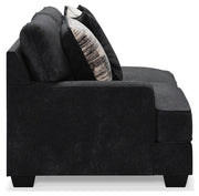 Ashley Furniture Lavernett living room set featuring a sofa and loveseat with neutral upholstery and wooden legs.