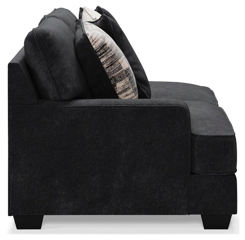 Ashley Furniture Lavernett living room set featuring a sofa and loveseat with neutral upholstery and wooden legs.