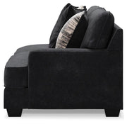 Ashley Furniture Lavernett living room set with plush sofa and matching armchair, featuring neutral fabric and modern design.