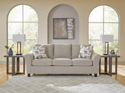 Ashley Furniture Willarae Sofa Sleeper with plush fabric and convertible design, shown in a modern living room setting.