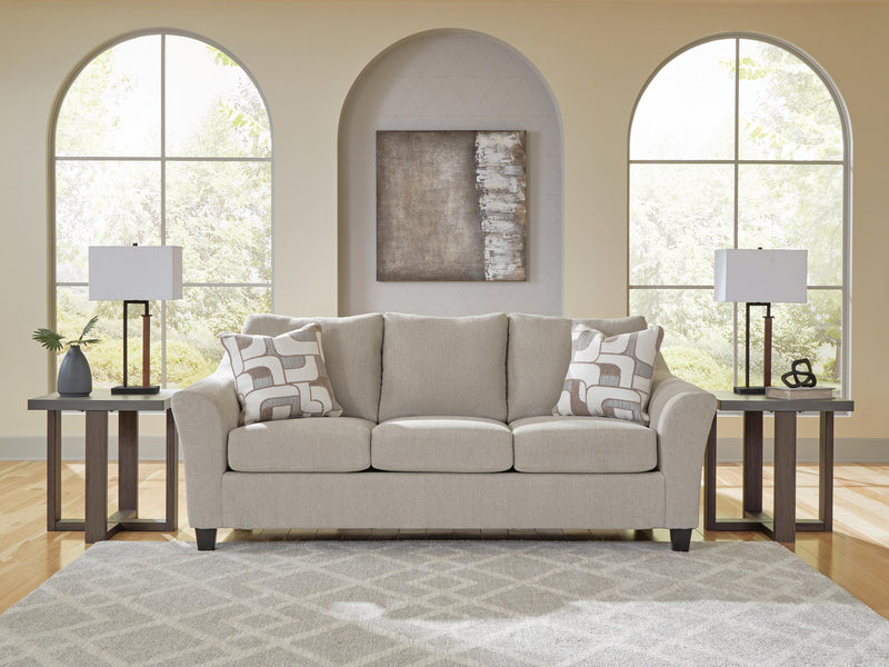 Ashley Furniture Willarae Sofa Sleeper with plush fabric and convertible design, shown in a modern living room setting.