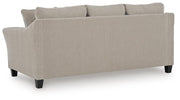 Willarae Sofa Sleeper by Ashley Furniture showing the back view with plush cushions and modern design in a living room setting.
