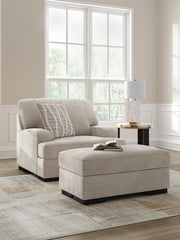 Ashley Furniture high profile living room set with chair and ottoman, featuring plush upholstery and modern design.