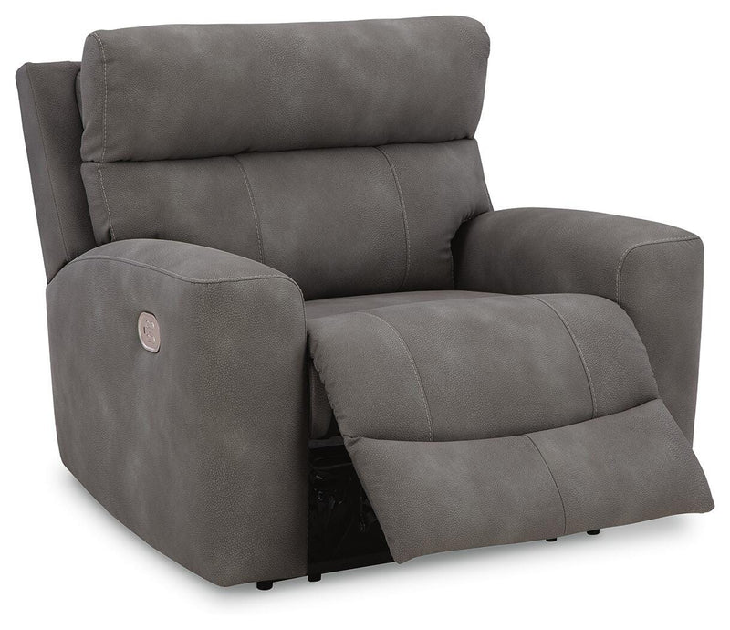 Open Ashley Furniture Next-Gen DuraPella power recliner showing plush upholstery, padded armrests, and reclining mechanism.