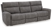 Ashley Furniture Next-Gen DuraPella power reclining sectional sofa shown from an angle with plush cushions and modern design.