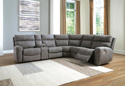 Ashley Furniture Next-Gen DuraPella power reclining sectional with plush cushions and modern design, shown in an open position.
