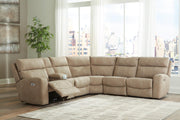 Ashley Furniture Next-Gen DuraPella power reclining sectional with plush fabric and multiple seating sections, shown in a modern living room setting.