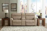Next-Gen DuraPella power reclining sectional loveseat with console by Ashley Furniture, showcasing plush cushions and built-in cup holders.