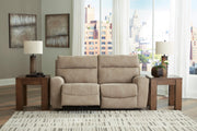Open view of Ashley Furniture Next-Gen DuraPella Power Reclining Sectional Loveseat, showcasing plush cushions and reclining mechanism.