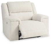 Ashley Furniture Keensburg living room set with sofa, loveseat, and armchair arranged in a cozy, modern living space.