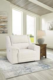Ashley Furniture Keensburg living room set with sofa, loveseat, and armchair in neutral upholstery, arranged in a modern living space.