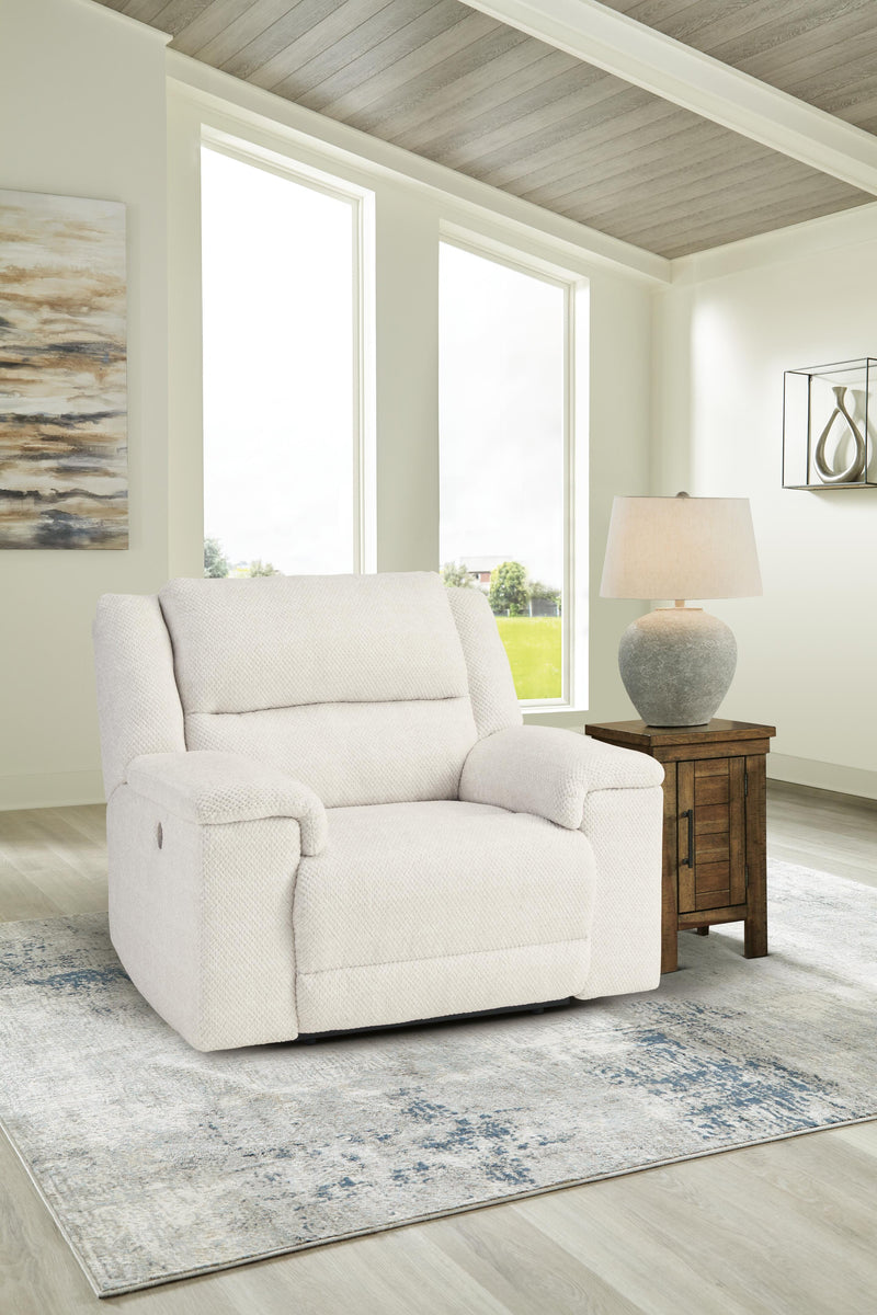Ashley Furniture Keensburg living room set with sofa, loveseat, and armchair in neutral upholstery, arranged in a modern living space.